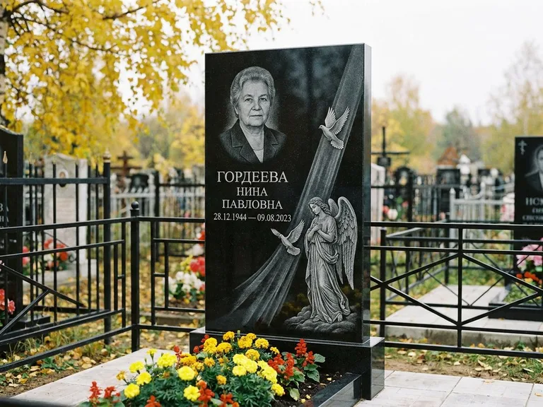 Памятник с гравировкой ангела — гравировка ангела с голубем по диагонали стелы, работа «Гордеева» в Нижневартовске