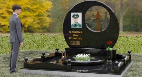 Памятник с техникой из чёрного гранита с детальной гравировкой